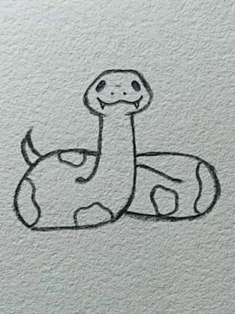 a drawing of a snake sitting on the ground