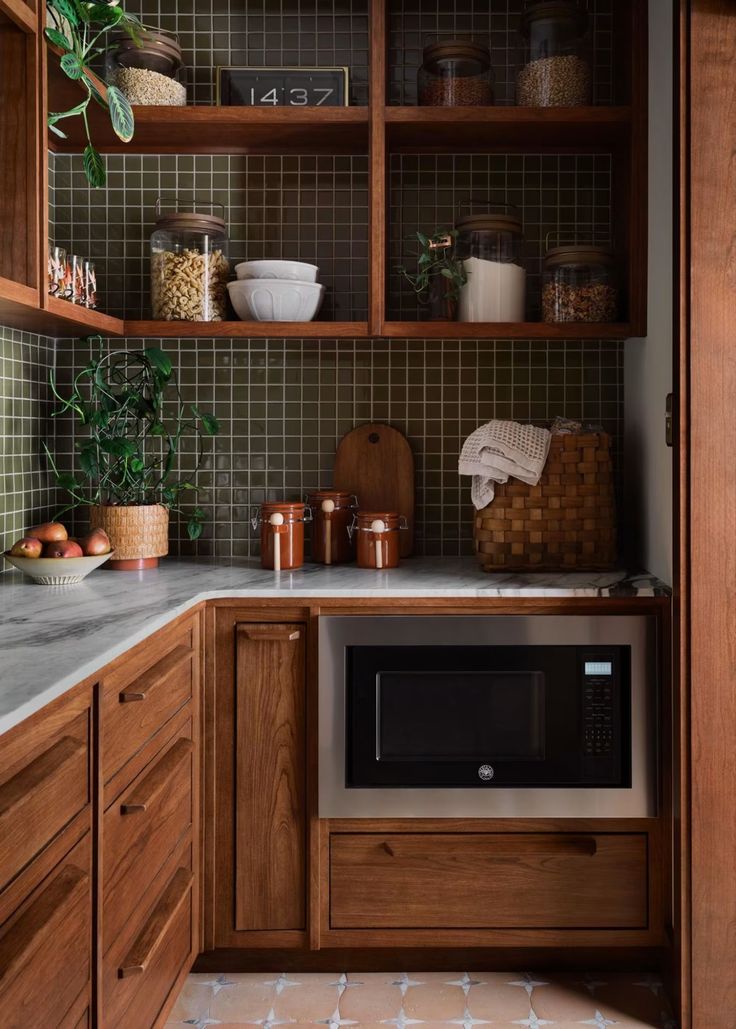 a kitchen with wooden cabinets and tile backsplash