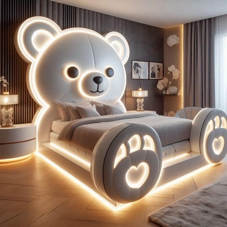 a teddy bear shaped bed with lights on the headboard and foot board is lit up