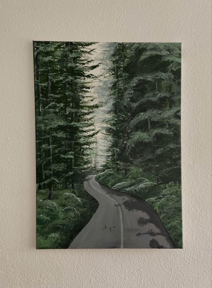 a painting hanging on the side of a wall next to a white wall with trees