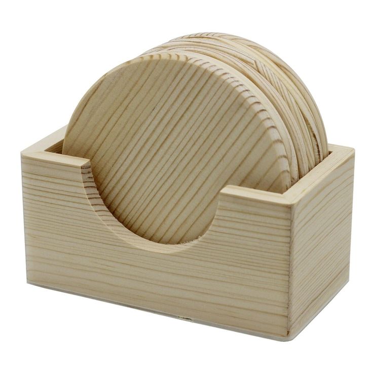 a set of four wooden coasters in a holder