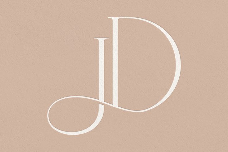 the letter j is shown in white on a beige background