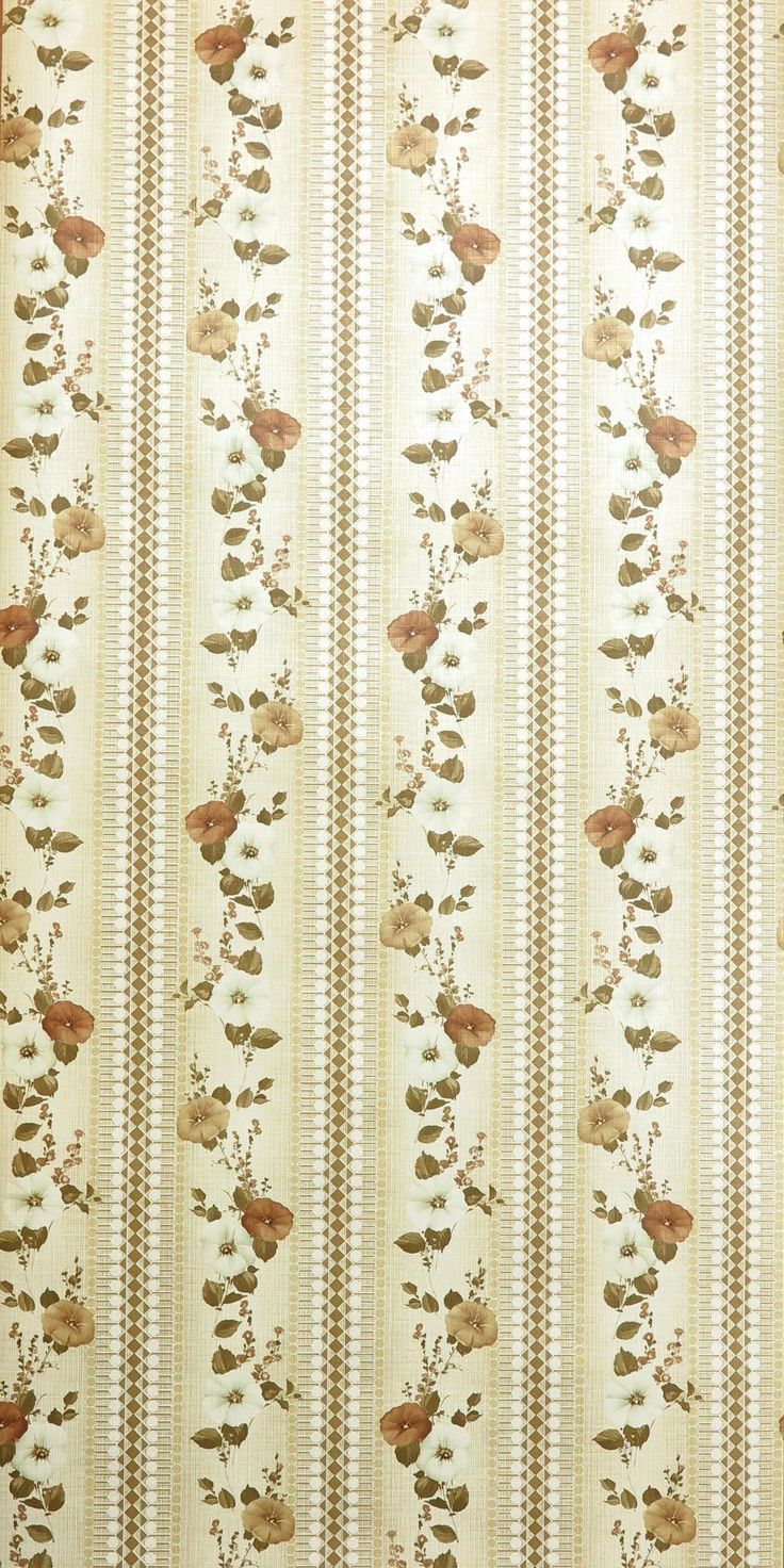 an old wallpaper with flowers and leaves on it's side, as well as stripes in the background