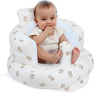 a baby is sitting in a white chair