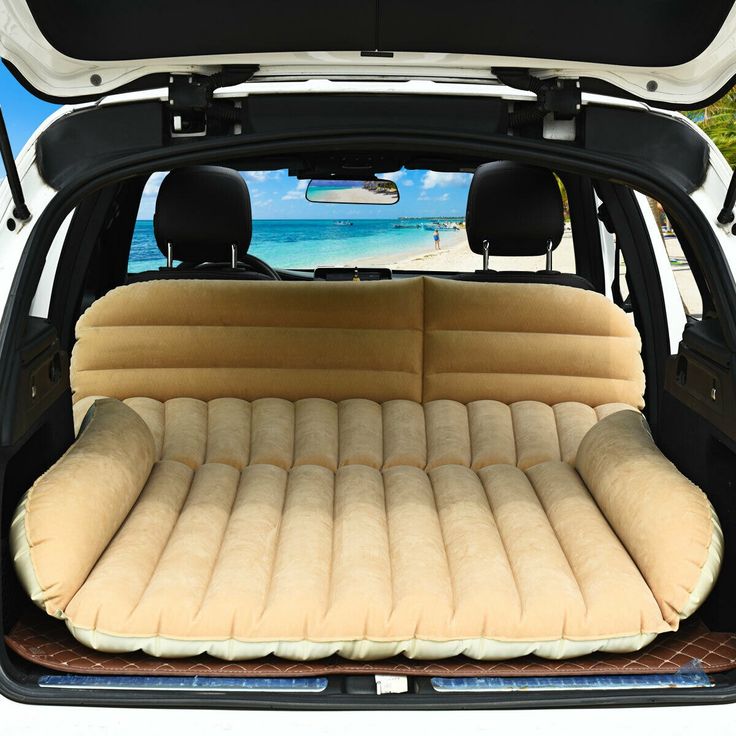 the back end of a car with an inflatable mattress