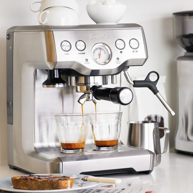 an espresso machine is being used to make coffee