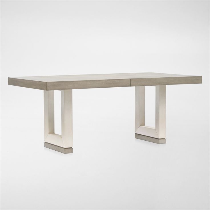 a table that is made out of concrete and has two legs on each end,