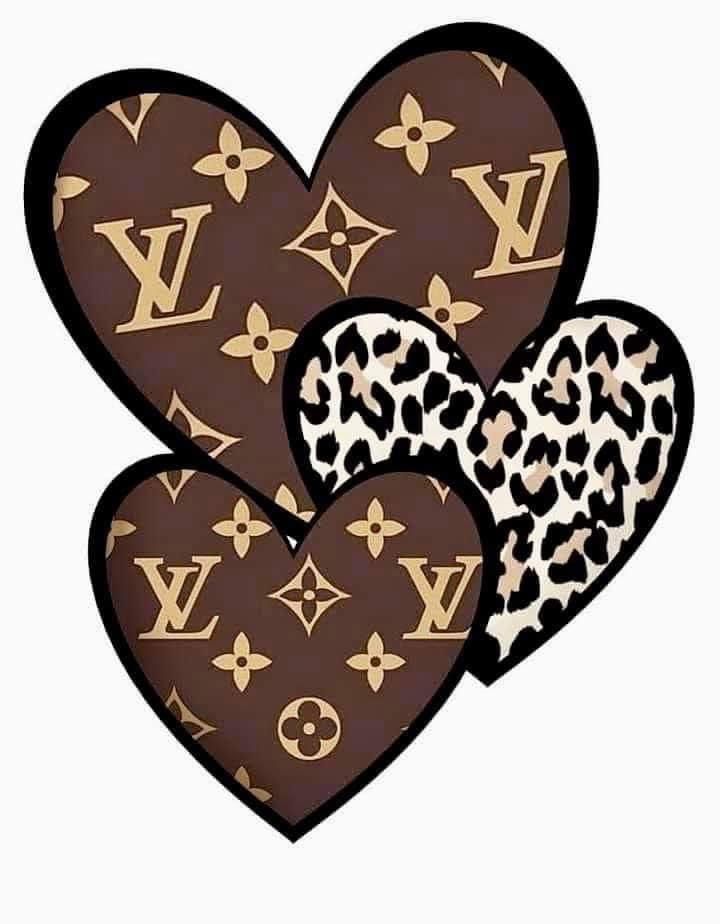 two hearts shaped like louis vuitton with leopard print on the inside and one in the middle