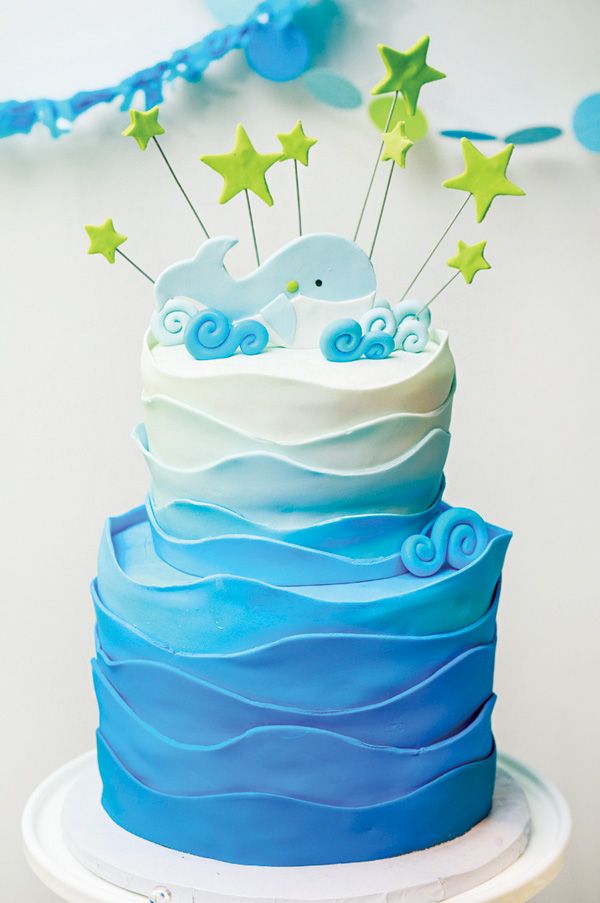 a blue and white cake with stars on top