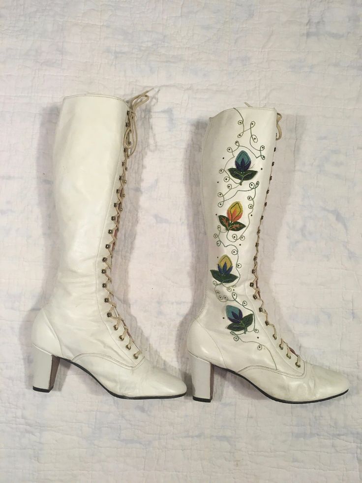 "1960s / early 70s GoGo boots white leather lace up embroidered floral detail w/tiny metal studs around the embroidery the flowers are embroidered patches and edges curl up a bit rubber heel and sole caps good vintage condition, light wear light scuffs, stains, age wear instep of right boot has a slight gap between sole and leather when worn the foot should secure this area w/it's weight could be taken to shop to secure *priced w/the possibility of that cost in mind label size 9 M, fit me true t Authentic 70s Fashion, White Gogo Boots, 70s Boots, 60s Women, Vintage Converse, Wedding Boots, Embroidered Boots, Boots White, Gogo Boots