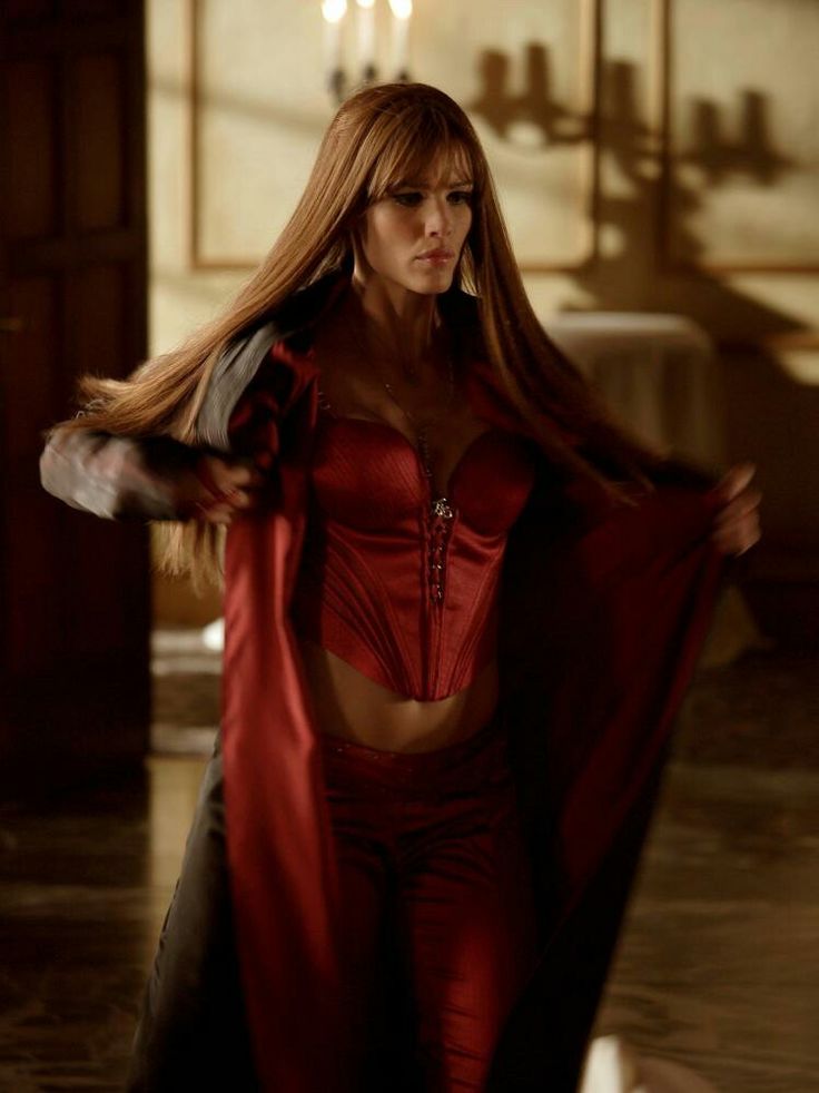 a woman in a red corset with long hair