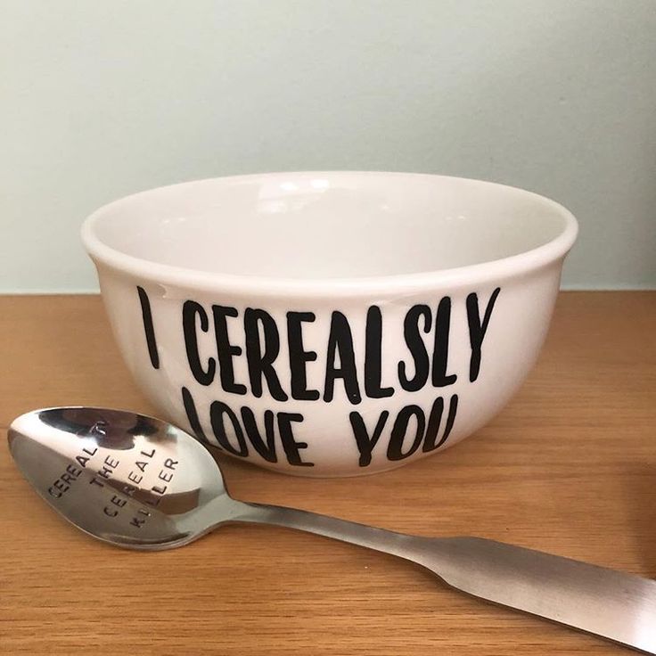 a bowl and spoon on a table with the words i cereally love you printed on it