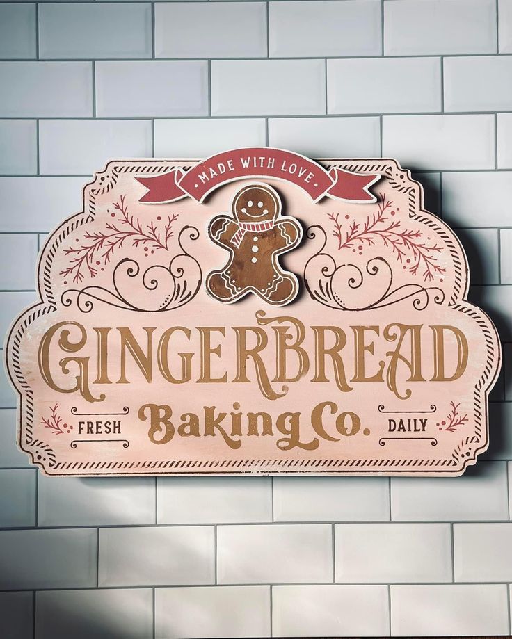 gingerbread baking co sign on the side of a brick wall in front of a white tiled wall