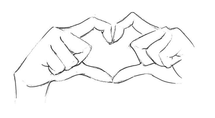 two hands making a heart shape with their fingers