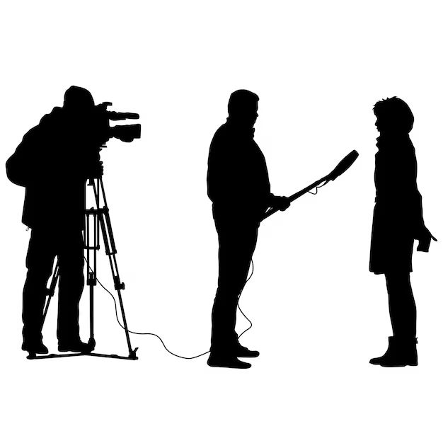 three people are standing in front of a camera and one person is holding a microphone