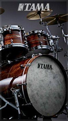 the tama drums are on display in front of a black background with white lettering