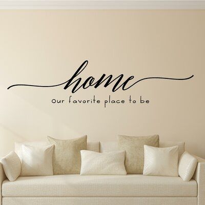 a wall decal with the words home in cursive font on it's side