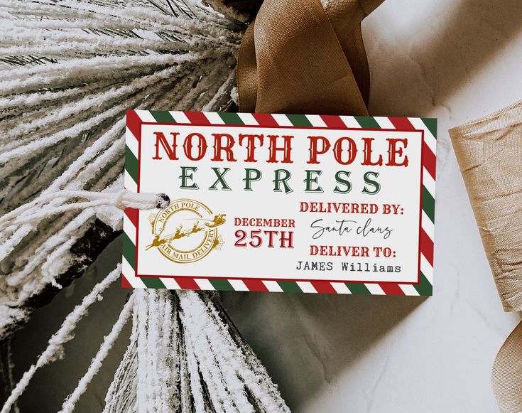 a christmas ornament is hanging from a ribbon on a door hanger that says north pole express