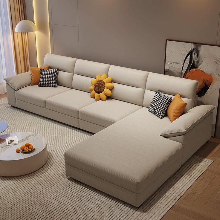 a living room filled with furniture and a large sunflower pillow on the back of the couch