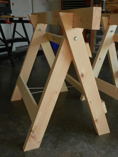 three wooden structures are sitting on the floor