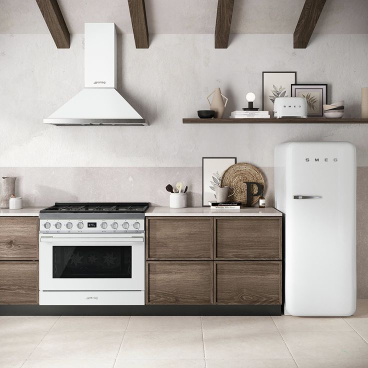 a white stove top oven sitting inside of a kitchen