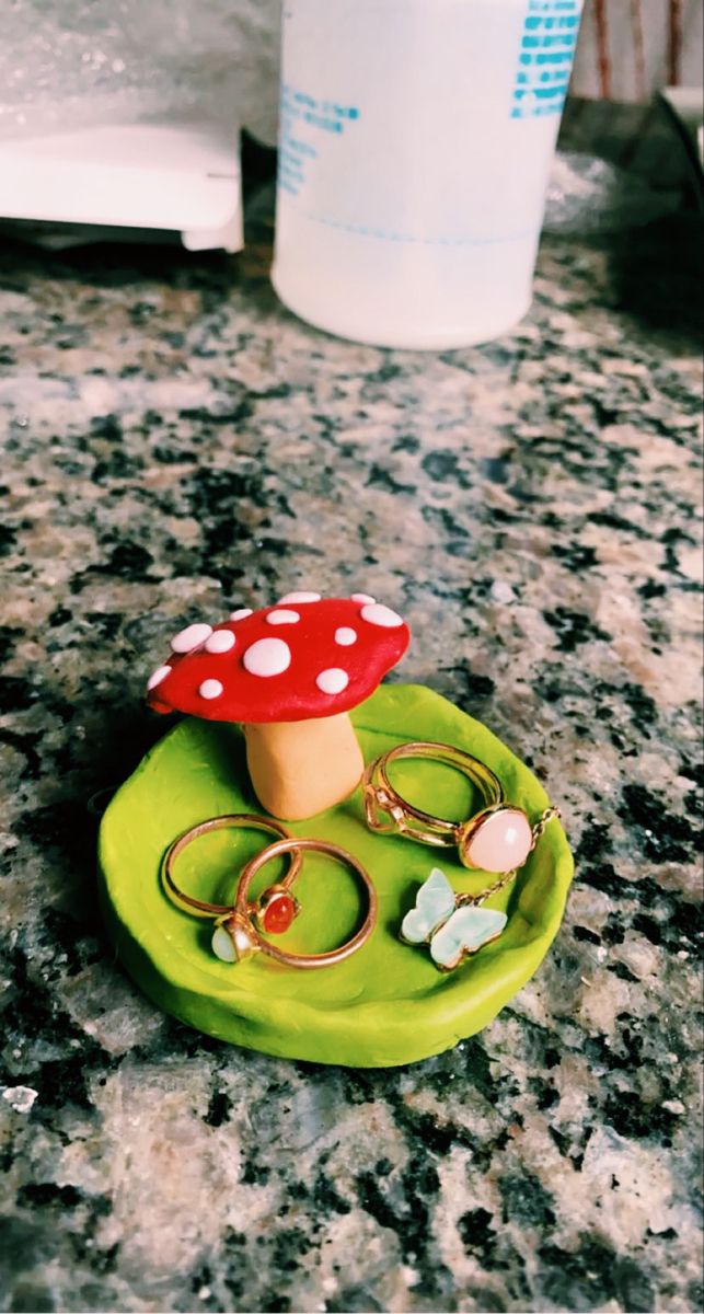 a green plate topped with two rings and a mushroom