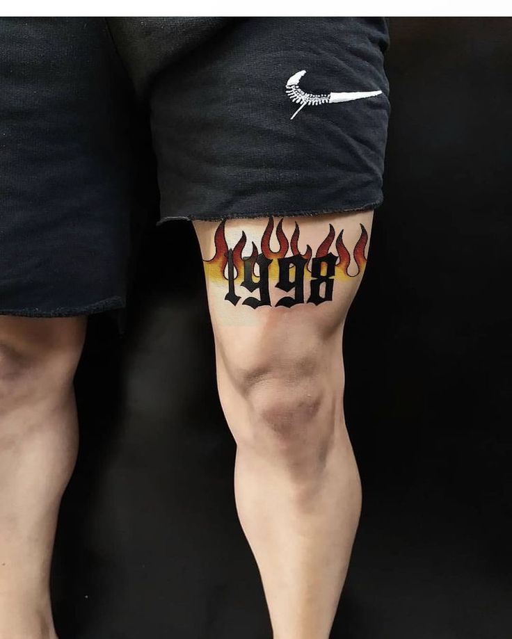 Flame Age 1998 Leg Tattoo, 1998 Tattoo Men, Tattoo For Legs, Simple Tattoos Men Leg, Mens Knee Tattoo Ideas, Cool Leg Tattoos For Guys, Legs Tattoo Men, Above Knee Tattoo Men, Over Knee Tattoo Men