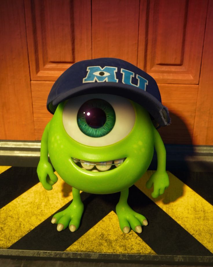 a green monster with big eyes and a hat on top of it's head