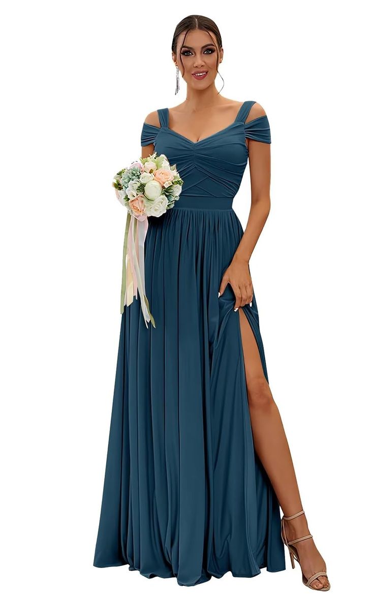 a woman in a long blue dress holding a bouquet and posing for the camera with her leg