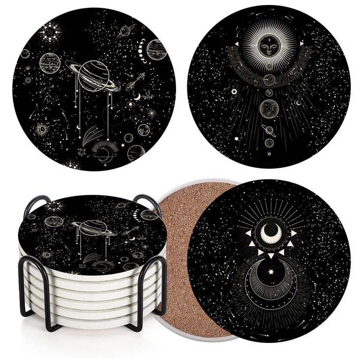 four black and white plates with different designs on them, one has an image of the moon