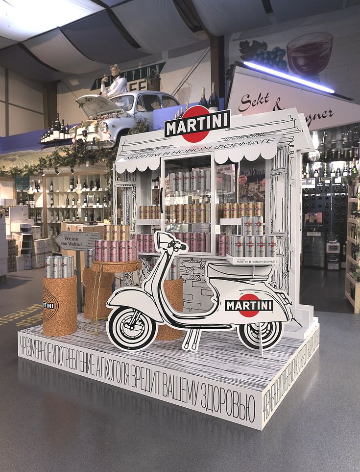 a display in a store filled with lots of bottles and vespa type items