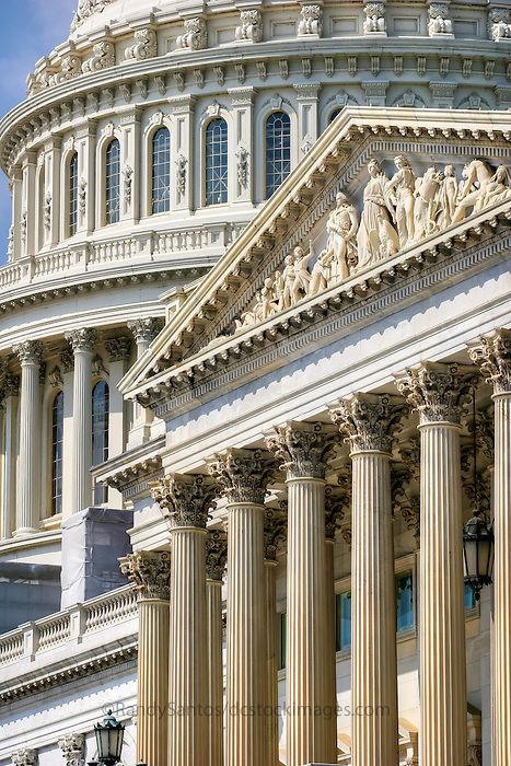 the capital building in washington, d c with columns and statues on it's sides