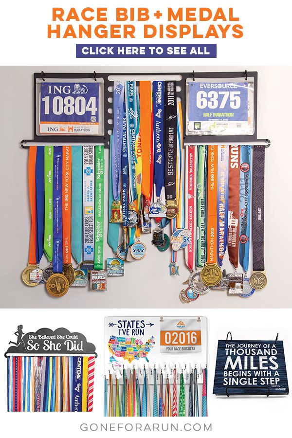 the race bib medal hanger is displayed with medals and other items for sale