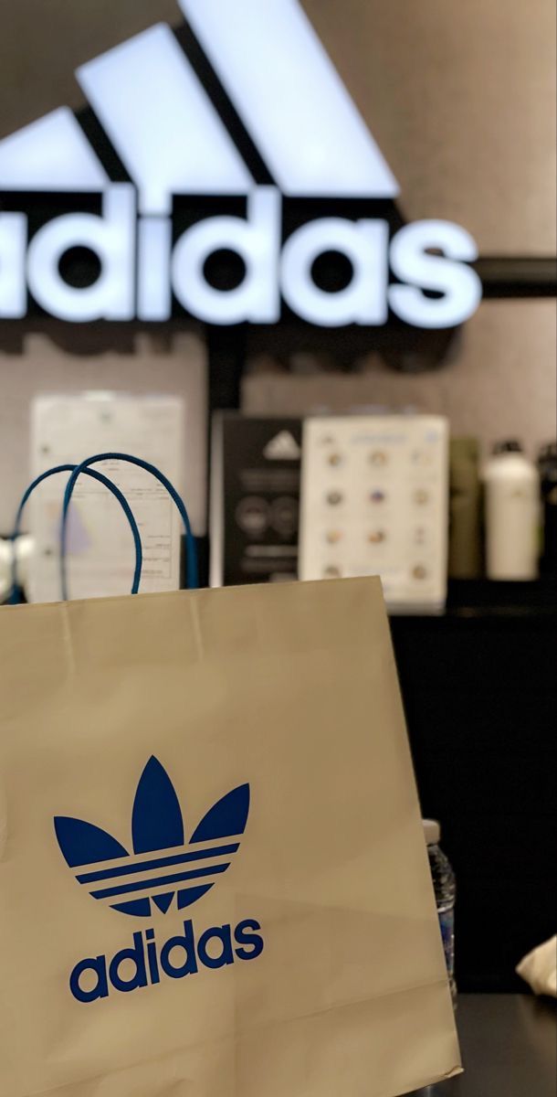 a shopping bag with the adidas logo on it