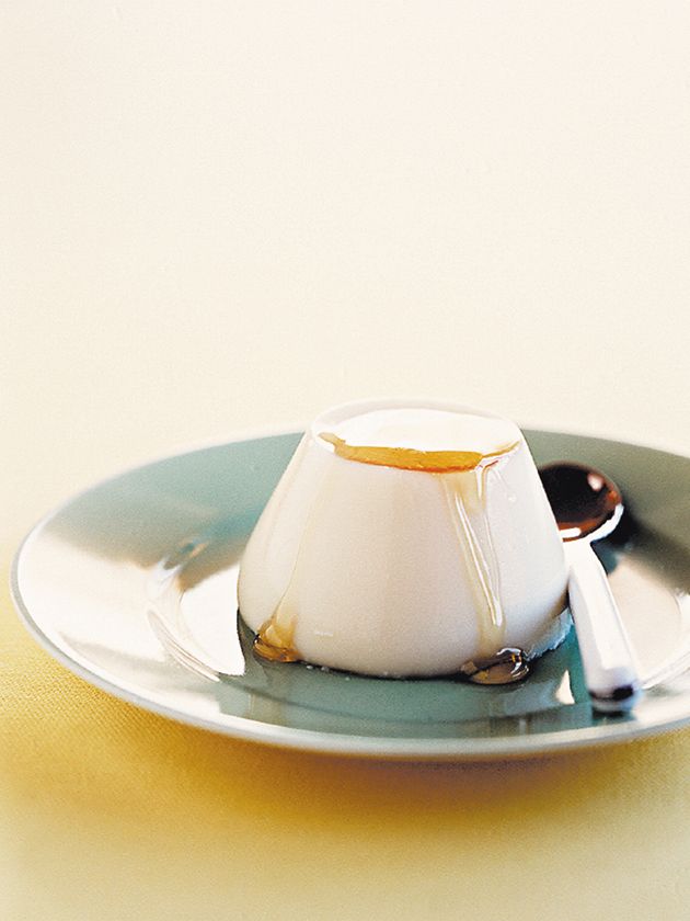 a small dessert on a plate with spoons