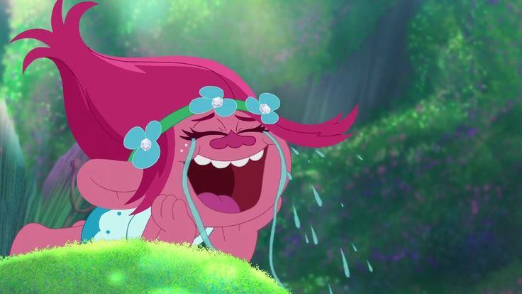 the pinkie is laughing in front of some trees