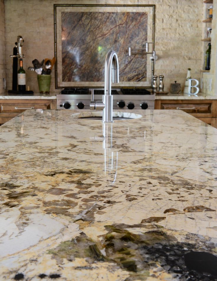 a kitchen counter top with a faucet in the middle