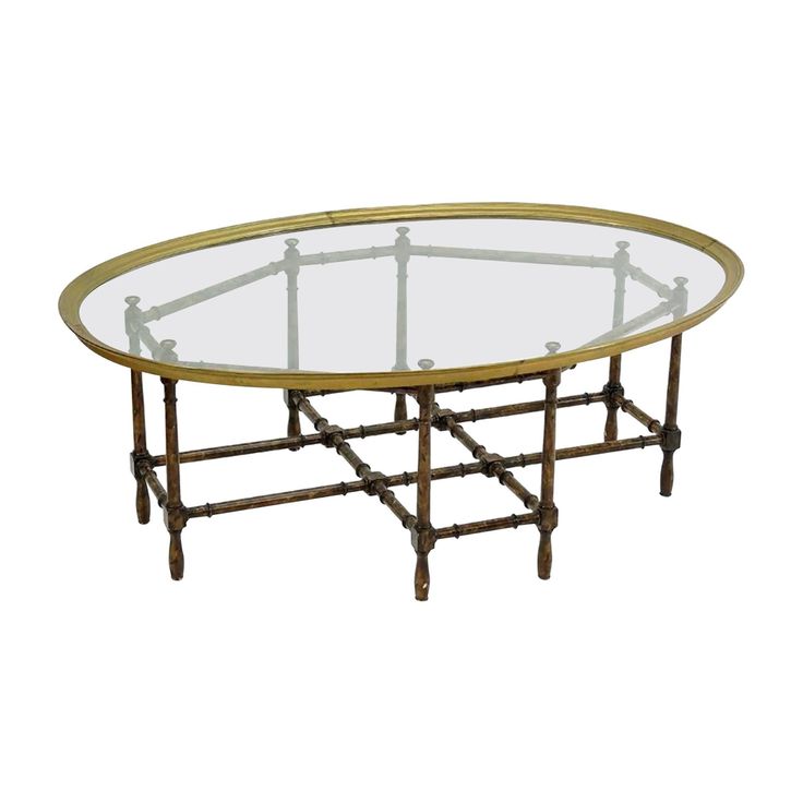 an oval glass table with metal legs