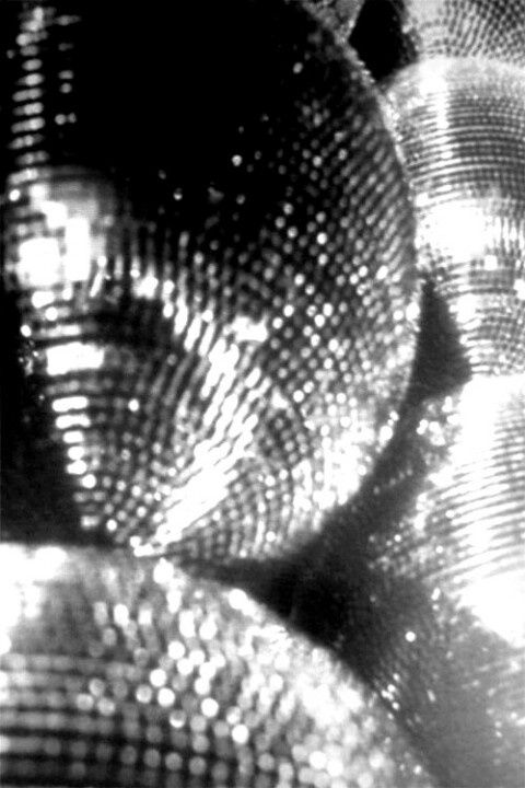 an image of shiny disco balls in black and white