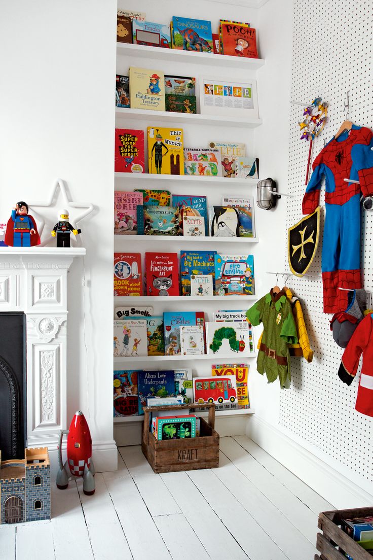 a child's room with bookshelves and toys