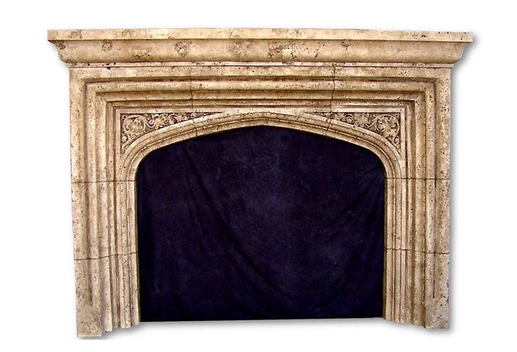 an old fireplace with a black cover on it's mantle and the top section is made out of marble