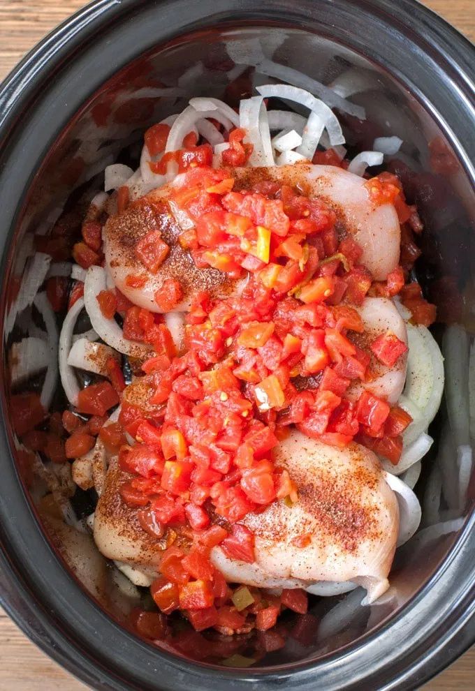 the food is prepared and ready to be cooked in the slow cooker