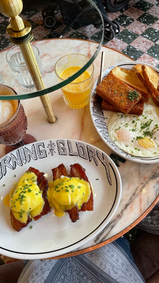 two plates with eggs and toast on them