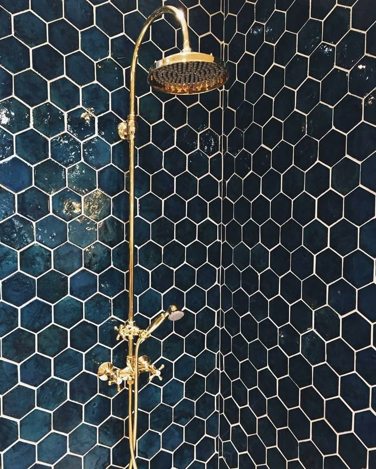 the shower head is gold in color