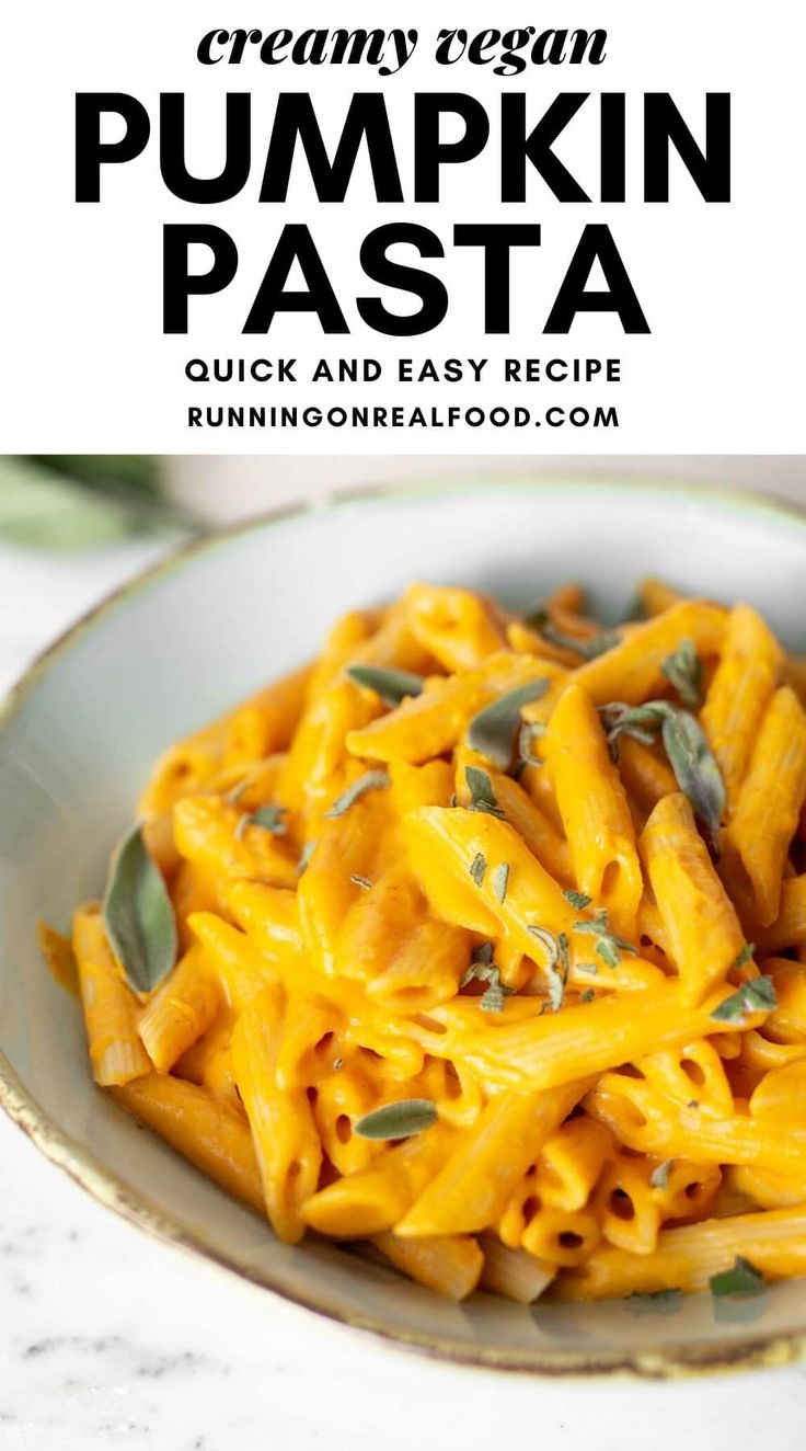 creamy vegan pumpkin pasta in a white bowl on a marble table with text overlay