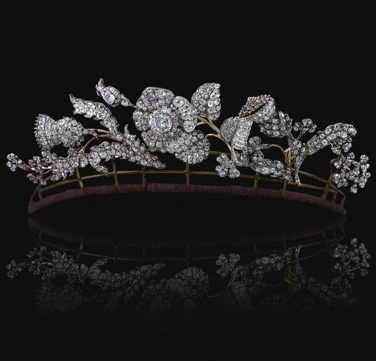 DIAMOND TIARA/CORSAGE ORNAMENT, EARLY 19TH CENTURY, Designed as five foliate sprays, each symbolising one of the three Kingdoms of the United Kingdom of Great Britain, centring on a single rose flower head set en tremblant, emblematic of England, flanked with the thistle and shamrock, symbolising the Kingdoms of Scotland and Ireland, set with old-mine, circular-cut and cushion-shaped diamonds,  five foliate sprays all detachable accompanied by six detachable brooch pins. Floral Tiara, Royal Crowns, Royal Tiaras, Diamond Tiara, Diamond Bows, Poutine, Royal Jewels, Royal Jewelry, Crown Jewels