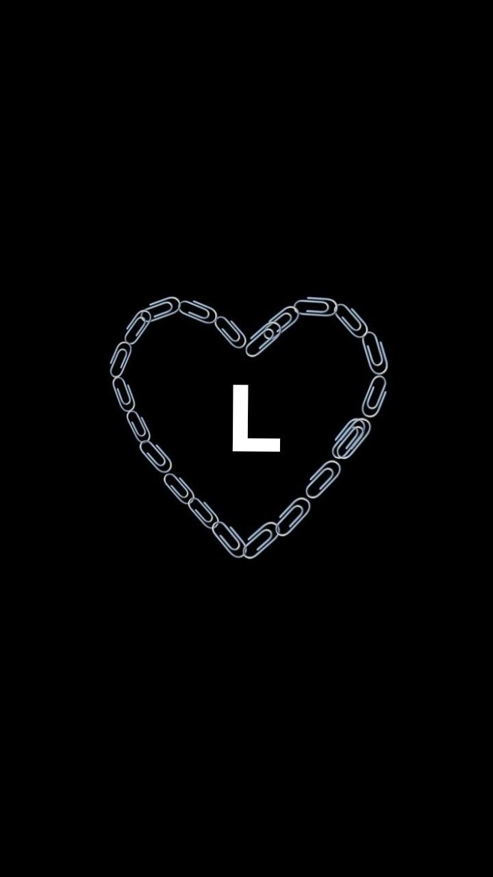 the letter l is made up of chains in the shape of a heart on a black background