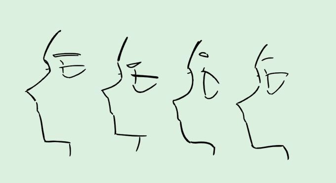 three faces are drawn in black and white on a light green background with the words,