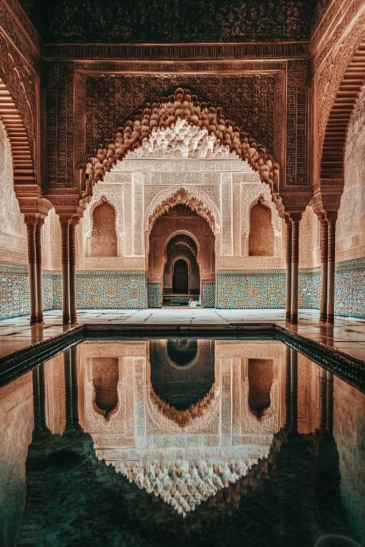 an ornate building with a pool in the middle and water reflecting it's reflection