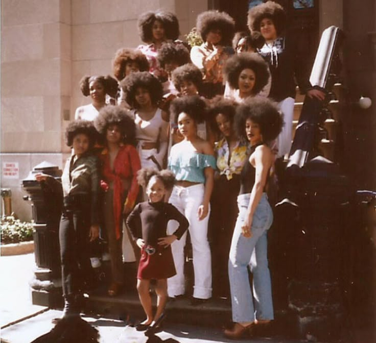 a group of women and children posing for a photo